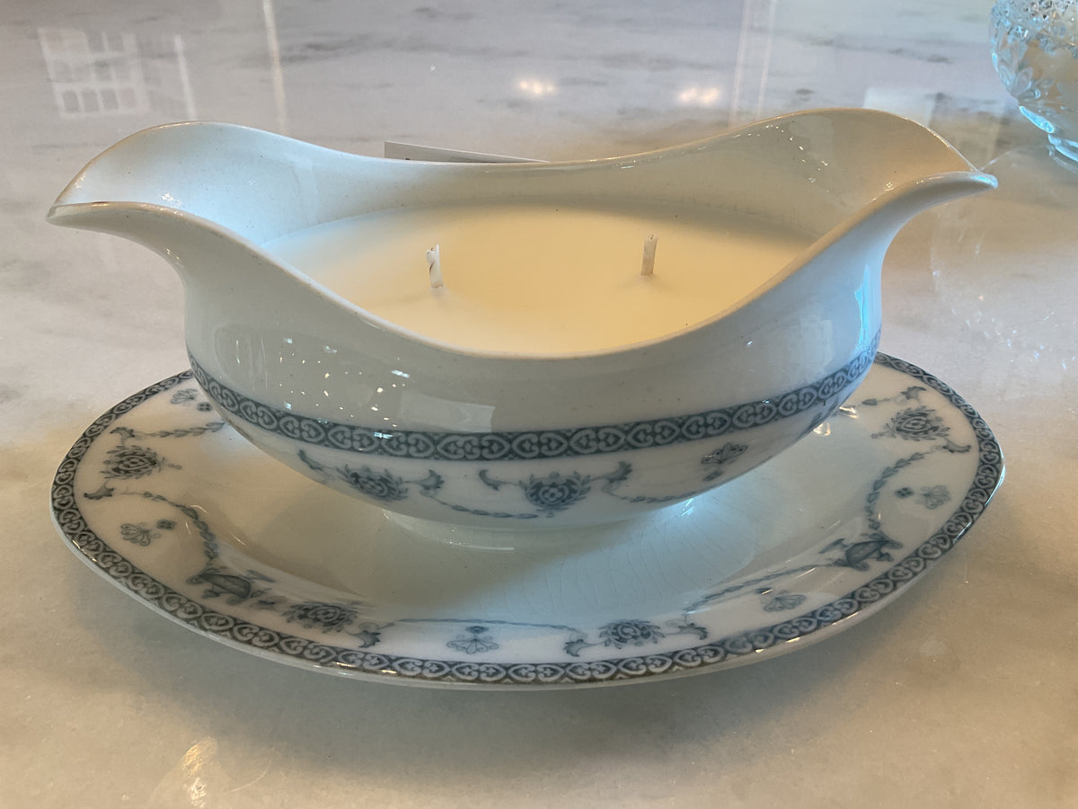 Antique blue and white candle on a plate