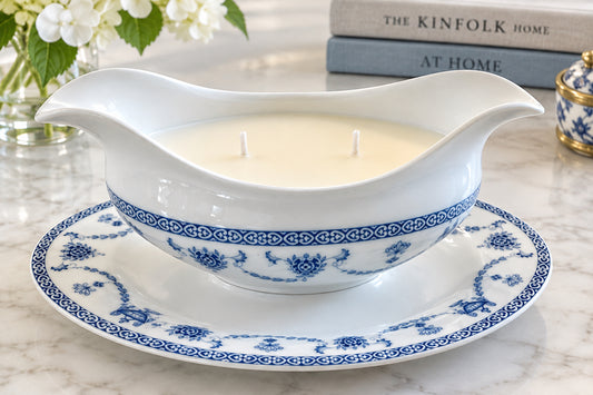 Antique blue and white candle on a plate