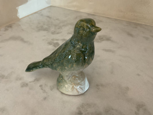 Glazed ceramic bird figurine standing